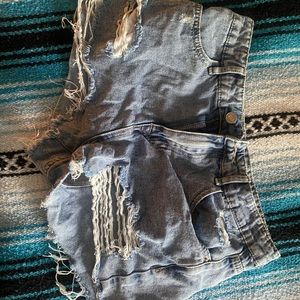 Ripped . Blue Jean Shorts .